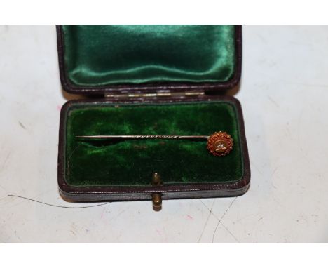 A 9ct gold ring set with diamond. Approx. 1.9g, ring size K/L and a yellow metal stick pin set with diamond Approx. 1.2g