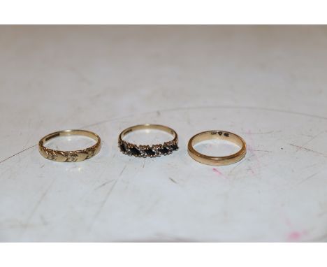 A 10K marked ring, size L, a 9ct gold chip diamond set ring size O, a 9ct gold ring set with blue and white stones, size P to