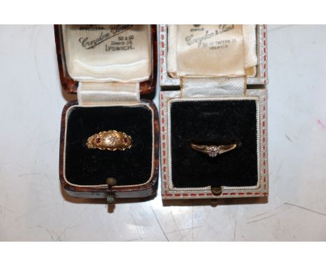 An 18ct gold gypsy ring set with garnets and central chip diamond, ring size O. Approx. 2.2g