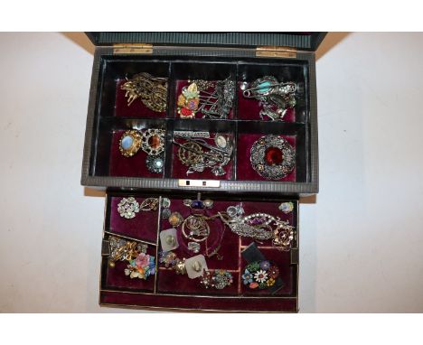 A jewellery box and contents of various costume brooches , bracelets, dress ring etc. 
