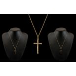 A 9ct Gold Cross Attached to a 9ct Gold