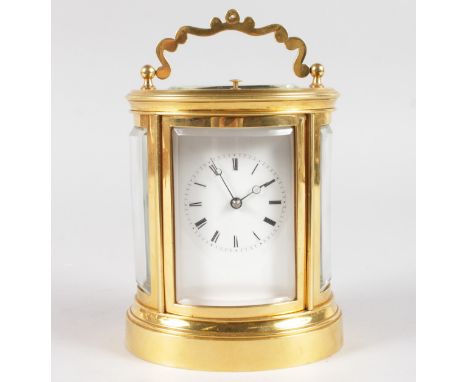 A GOOD 19TH CENTURY FRENCH BRASS OVAL CARRIAGE CLOCK, stamped Japy Freres et Cie, Exposition 1888, Grande Med. D'Honneur.