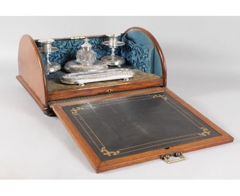 A TAMBOUR FRONTED DESK SET with inkwell, pen tray and pair of candlesticks with sliding writing surface. 15ins wide.