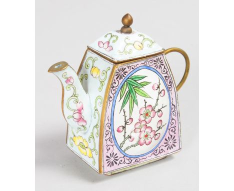 A SMALL CHINESE ENAMEL TEAPOT AND COVER, painted with panels of flowers.  9cms.