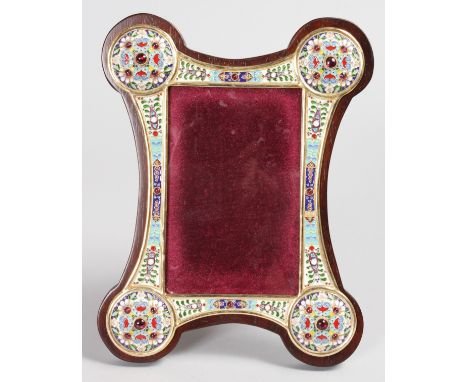 A VERY GOOD RUSSIAN SILVER AND ENAMEL SHAPED UPRIGHT PHOTOGRAPH FRAME, with coloured enamel and garnets. 9ins high, 7ins wide