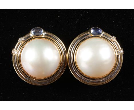A LARGE PAIR OF PEARL EAR CLIPS set with diamonds in yellow gold.