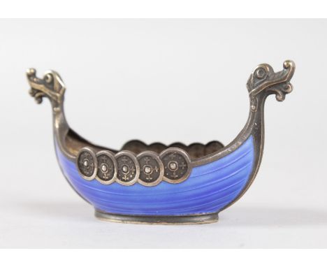 A SMALL NORWEGIAN STERLING SILVER AND BLUE ENAMEL VIKING SHIP SALT, stamped 925 S. STERLING NORWAY. 3.25ins long.
