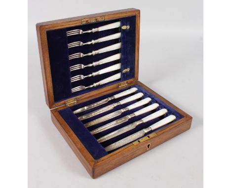 A CASED SET OF SIX KNIVES AND FORKS with mother-of-pearl handles. Sheffield 1924.  Maker: A. F.