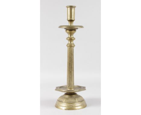 AN EARLY CONTINENTAL ETCHED CANDLESTICK with drip pan, on octagonal and circular base. 15ins high.