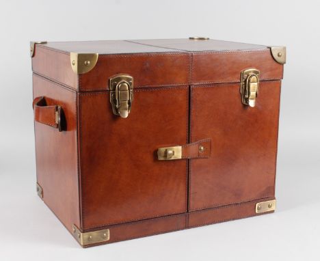 A GOOD LEATHER FOLDING FITTED HAMPER with brass locks and carrying handles. 17ins wide, 14ins high.