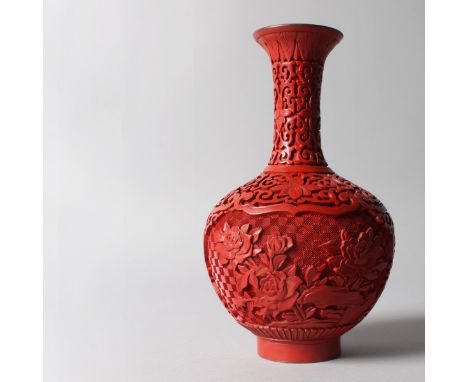 A CHINESE RED CINNABAR LACQUER BULBOUS VASE. 9ins high.