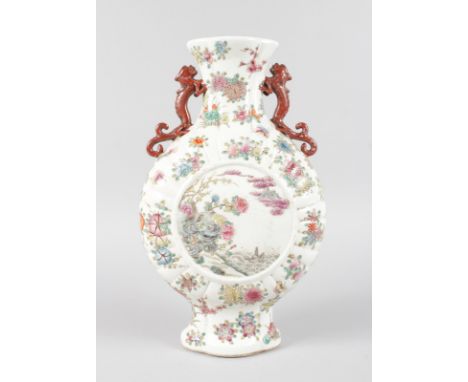 A CHINESE PORCELAIN MOON FLASK painted with flowers. 14ins high.