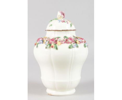 AN 18TH CENTURY MENNECY FLORAL ENCRUSTED VASE AND COVER painted with flowers to cover and under side of vase. 7ins tall.