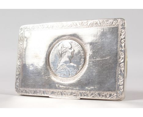 A CONTINENTAL SILVER TABLE SNUFF BOX, the lid inset with a THALER.  4.75ins wide.