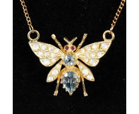 A SILVER, GOLD PLATED, BLUE TOPAZ, OPAL AND RUBY BUTTERFLY NECKLACE AND CHAIN.