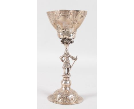 AN EARLY DUTCH SILVER CHALICE, the stem as a nobleman holding a stick. 7.75ins high.