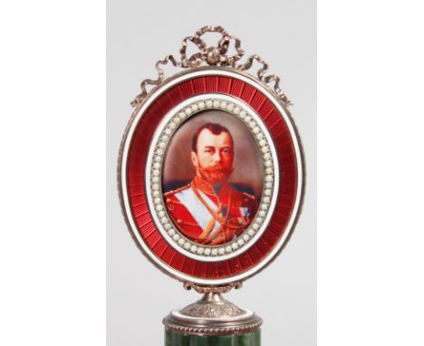 A SUPERB FABERGE STYLE JADE, ENAMEL AND SEED PEARL PORTRAIT MINIATURE OF NICHOLAS II, on a column with square base. 7.5ins hi