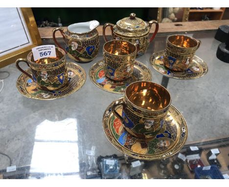 A JAPANESE POTTERY PART TEA SERVICE COMPRISING FOUR CUPS AND SAUCERS, SUGAR BOWL AND MILK JUG 