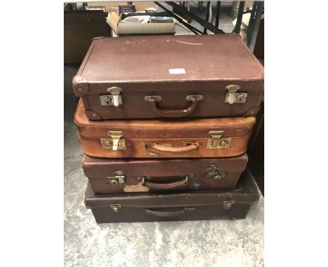 A STACK OF FOUR VINTAGE BRIEFCASES 