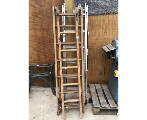 A VINTAGE EIGHTEEN RUNG THREE SECTION LADDER AND AN ALLOY TWELVE RUNG TWO SECTION LADDER 