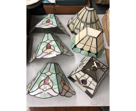 A COLLECTION OF SIX STAINED GLASS LIGHT COVERS 