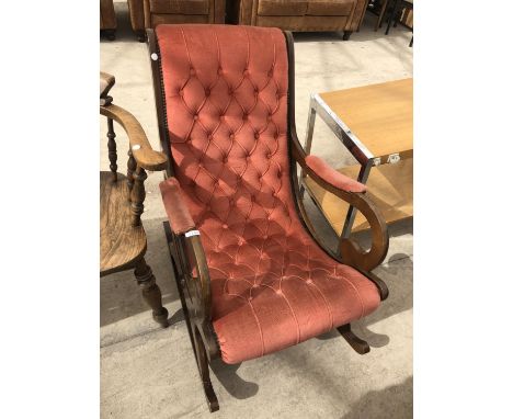 A MAHOGANY ROCKING CHAIR WITH UPHOLSTERED BUTTON BACK DESIGN 
