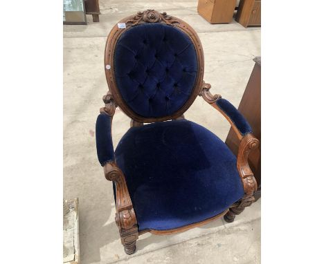 A CARVED MAHOGANY BEDROOM CHAIR WITH BLUE BUTTON BACK UPHOLSTERED DESIGN 