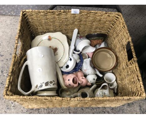 A WICKER BASKET OF ASSORTED CERAMICS, TEAPOT ETC 