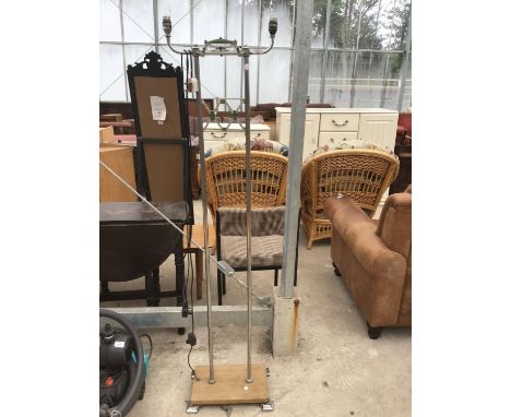 AN ART DECO STYLE TWIN STANDARD LAMP ON A WOODEN BASE 