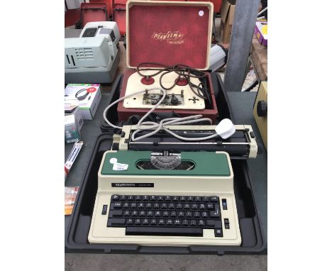 A SILVER REED 2600CR TYPE WRITER IN WORKING ORDER AND A PLAYTIME VINTAGE TAPE RECORDER 
