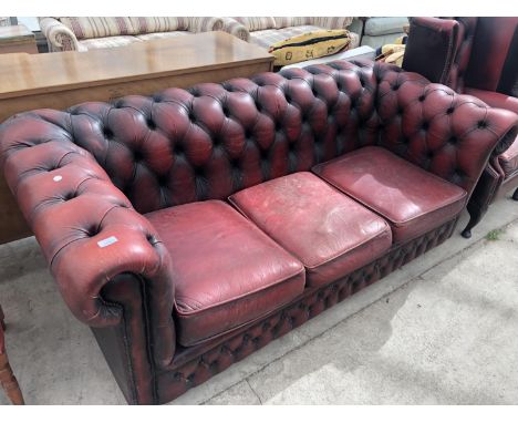 A RED OX BLOOD LEATHER CHESTERFIELD THREE SEATER BUTTON BACK SOFA 