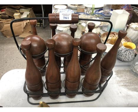 A SET OF WOODEN GARDEN BOWLING PINS AND BALLS 