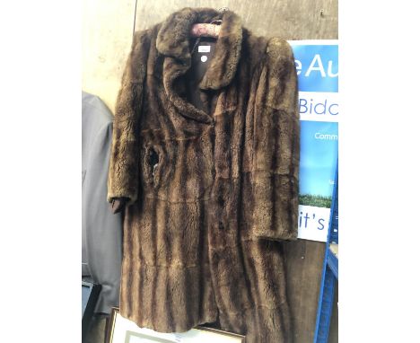 A LADIES LONG VINTAGE FUR JACKET 