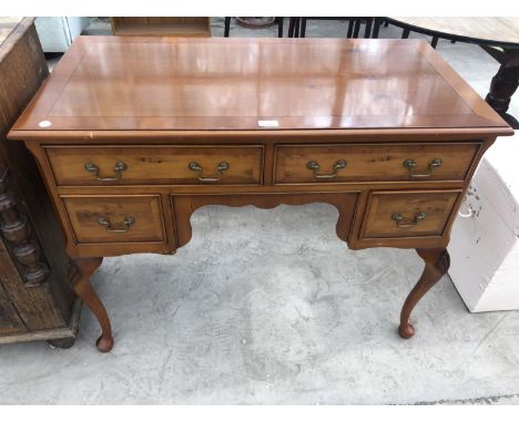 A LIGHT YEW WOOD LOW BOY WITH FOUR DRAWERS AND QUEEN ANNE STYLE SUPPORTS 