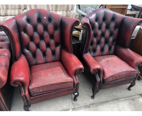 A PAIR OF RED OX BLOOD LEATHER CHESTERFIELD BUTTON WING BACK ARMCHAIRS 