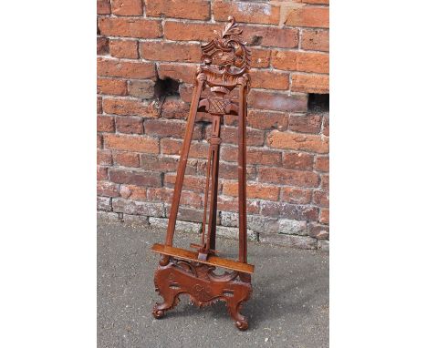 A SMALLER REPRODUCTION MAHOGANY EASEL, with carved decoration, H 108 cm (upright)  Buyers - for shipping pricing on this lot,
