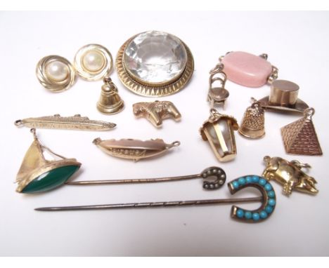 TWELVE ASSORTED GOLD AND YELLOW METAL CHARMS, together with a pair of earrings, a gilt metal brooch, and two horseshoe stick 