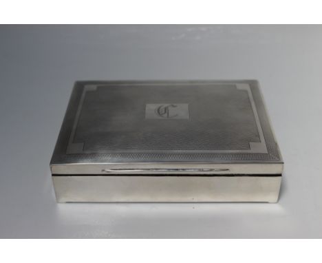 A HALLMARKED SILVER CIGARETTE BOX - BIRMINGHAM 1931, having typical engine turned decoration, maker's mark W.A., W 16 cm Buye