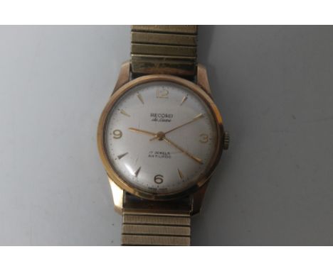 A 9 CARAT GOLD RECORD DE LUXE WRIST WATCH, having champagne dial, Roman numeral quarter hour markers, dagger hour markers, se