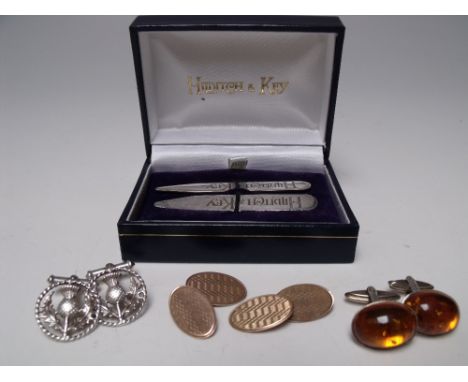 A PAIR OF 9CT GOLD CUFFLINKS, with engine turned decoration to the front panels, stamped and hallmarked to the reverse, toget