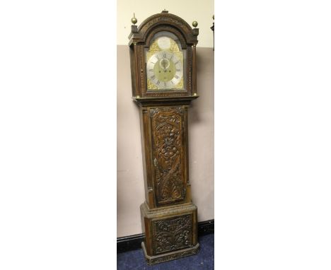 A 19TH CENTURY CARVED OAK LONGCASE CLOCK WITH EIGHT DAY MOVEMENT, the brass and silvered dial bearing maker's name 'Sam Wainw