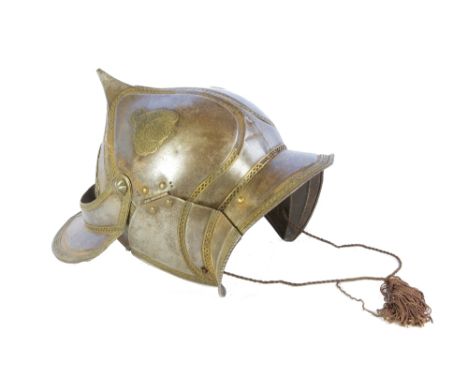 A 19TH CENTURY PERSIAN KHULA KHUD HELMET with opening visor and ear pieces, decorative brass edging all over, skull made up o