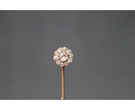 A DIAMOND STICK PIN, set with ten outer diamonds and a central diamond, the outer totaling approx 0.60 ct and the central dia
