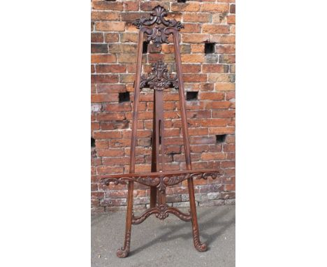 A LARGE REPRODUCTION MAHOGANY EASEL, with carved detail, H 185 cm (upright) Buyers - for shipping pricing on this lot, visit 