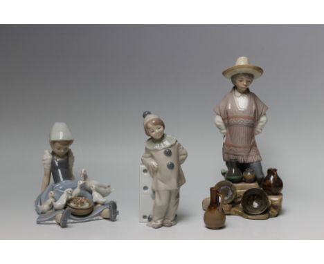 A COLLECTION OF THREE LLADRO FIGURES, to include a girl with ducklings, a potter selling his wares and a clown (3) Buyers - f