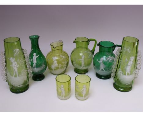 A COLLECTION OF MARY GREGORY DECORATIVE GLASSWARE, comprising light and dark green examples, to include three jugs, two small