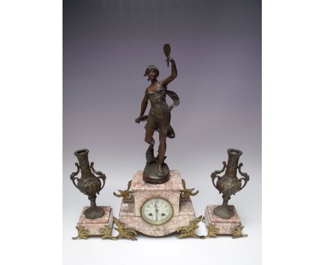 A FRENCH THREE PIECE ROUGE MARBLE AND SPELTER CLOCK GARNITURE, the clock body surmount with female figure holding mirror, the