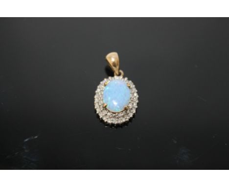 AN OPAL AND DIAMOND PENDANT, set with forty two brilliant cut diamonds totalling approx 0.42 carats and an oval opal measurin