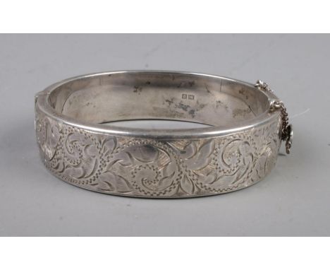 A 925 silver etched hollow bangle with hinge, assayed for Birmingham 1963.26.1g  