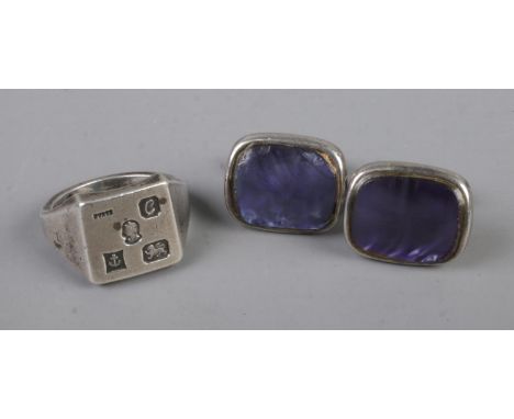 A gents silver signet ring with a pair of silver cufflinks.29.4gRing size T  